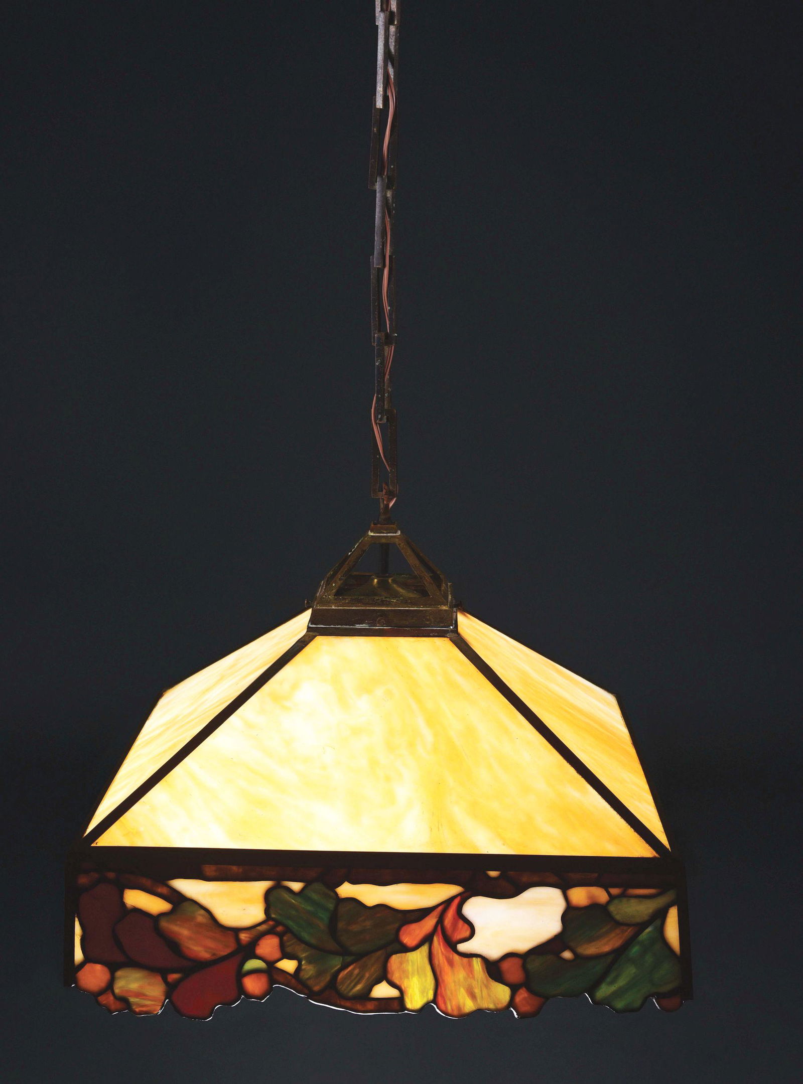 JOHN MORGAN & SONS LEADED GLASS ACORN HANGING LAMP.: Lovely and rare leaded glass hanging lamp by John Morgan and Sons. The shade features four triangular slag glass panels in shades of streaked caramel. The lower border is decorated with a series of mu
