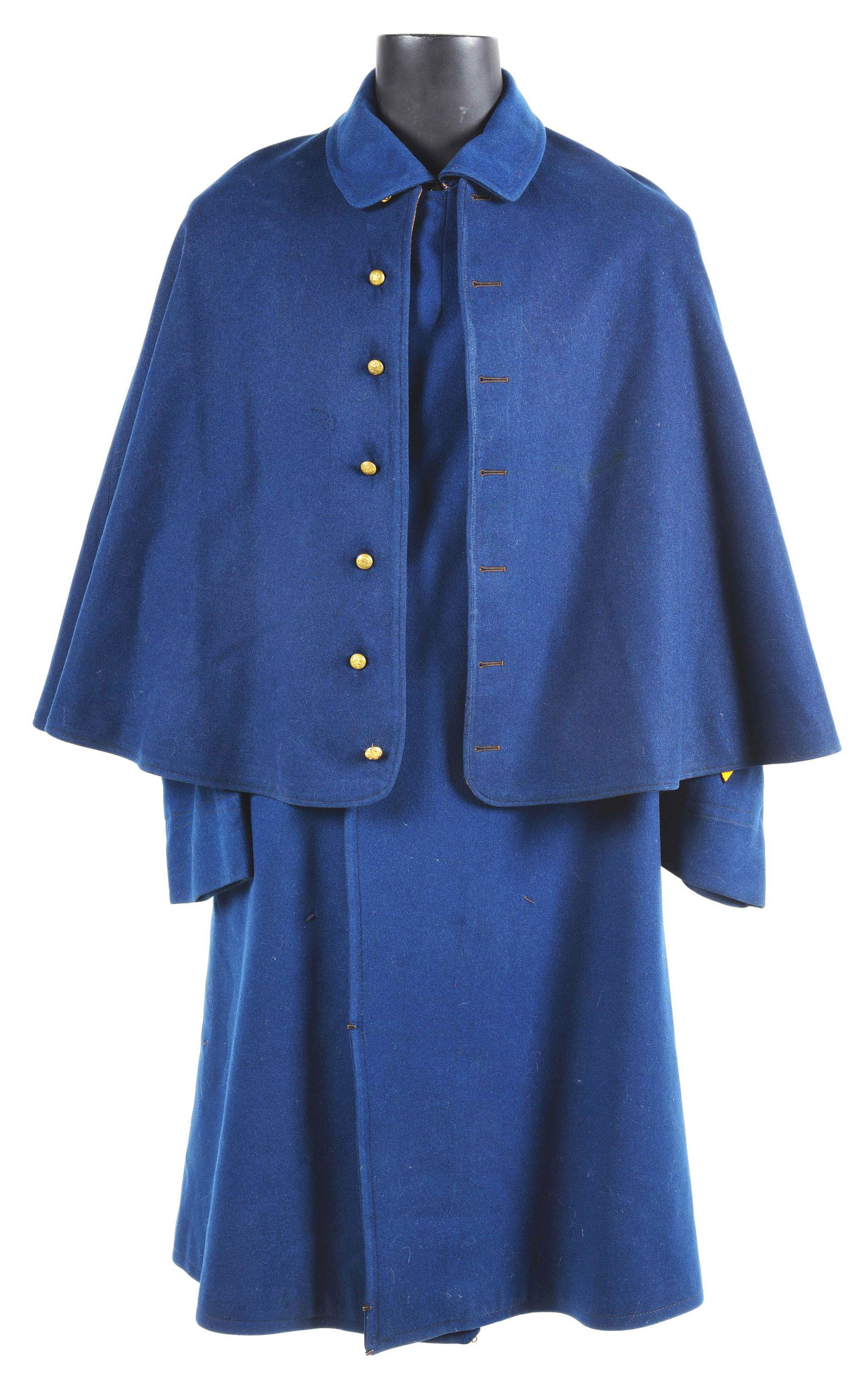 SCREEN WORN U. S. CAVALRY JACKET GREATCOAT: An original 1880's-1890's U. S. Army cavalry greatcoat with detachable cape. Used in John Ford westerns and numerous other films. Inside of the right sleeve on the original lining is printed "L. Levy