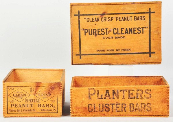 Lot of 3: Wooden Peanut Boxes.: One box with no lid is for Planters Cluster Bars and the other two (with lids) are for Clean and Crisp Peanut Bars. Moderate overall wear and soiling. Condition (Very Good). Size Largest: 11" x 7 - 1/
