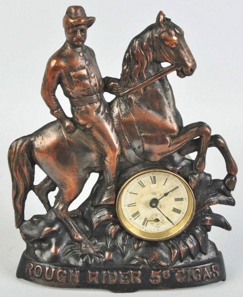 Rough Rider 5¢ Cigar Clock.: Circa 1910 to 1915 (or later). Average to moderate wear and marks. Condition (Very Good). Size 10 - 1/2" T.