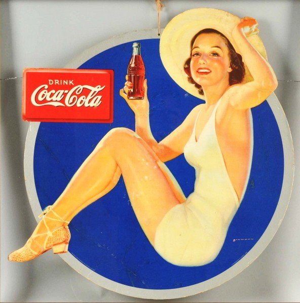 Cardboard Coca-Cola Cutout Sign.: 1938. Framed under plexiglass. This Canadian piece boasts nice color and graphics. General overall surface bends, rubs, light scratches, small nicks, and staple holes around the border with a bit of c