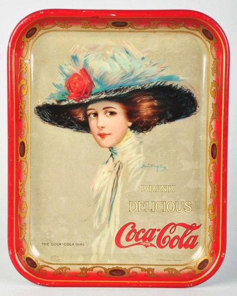 1910 Coca-Cola Serving Tray.: Good color and shine remains with general overall crazing, a number of stains in top half of tray that interrupt the gloss, one or two spots on border, and light outer edge nicks and wear. Displays ve