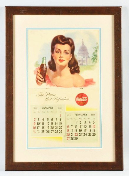 1944 Coca-Cola Calendar.: Framed and matted under plexiglass. A few small edge tears and minor tears near staples; otherwise, just light soiling and minor marks. Condition (Excellent). Size Framed: 28 - 1/2" x 20 - 1/2".