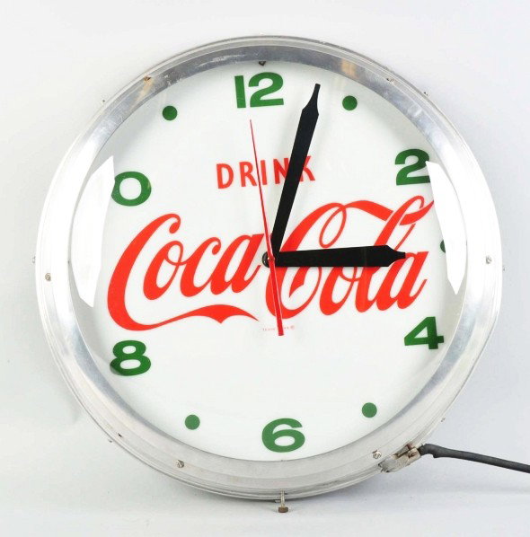 Coca-Cola Lighted Clock.: 1950s. Designed to stand the weather with outdoor use. Clean and bright with just minor case dents and light overall wear. Condition (Very Good - Excellent). Size 22 - 1/2" Dia.