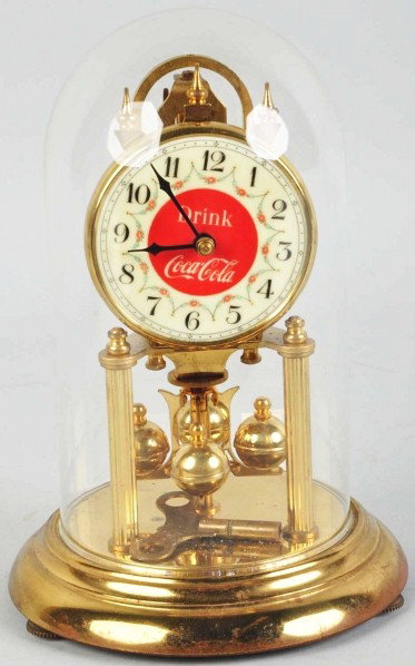Coca-Cola Dome Clock.: 1950s. Some light soiling, general wear to the plated surfaces, and clock face is slightly tilted. Condition (Very Good). Size 9 - 1/4" T.