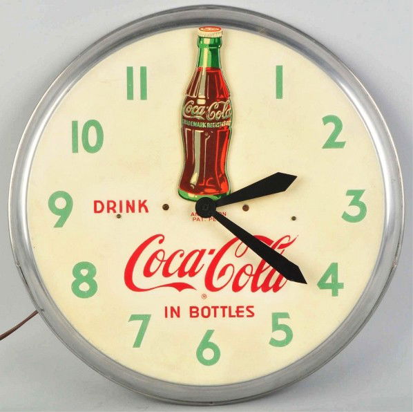 Coca-Cola Animated Electric Clock.: Circa 1948. The original bottle rocks back and forth between "11 o'clock" and "1 o'clock". Significant nice-quality restoration throughout. Condition (Very Good - Excellent). Size 19 - 1/2" Dia.