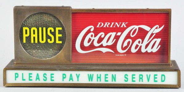Coca-Cola Pause Lighted Counter Sign.: 1950s. Operates and lights fine. Good-looking appearance with replaced glass on upper right side and lower panel. Overall heavy tarnish and case wear. Condition (Very Good). Size 19 - 1/2" L.