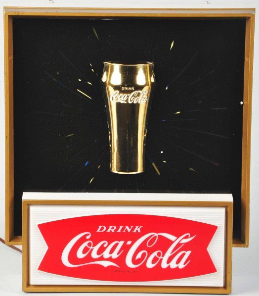 Coca-Cola Starburst Lighted Sign.: 1960s. Great overall appearance with only light to moderate overall wear and a few small rubs. Also, a few spots of minor color interruption on the glass, framework, and in a few tiny spots. This vers