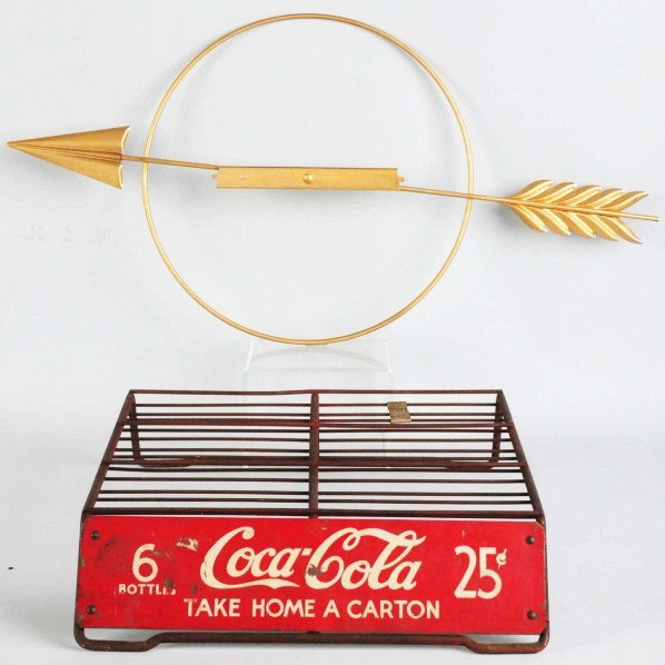 Coca-Cola Arrow, Ring, & Carton Display.: Metal ring has only light overall paint chips and nicks and is designed to display a metal cutout cooler in the center. The display rack has general overall wear with paint chips, nicks, and soiling. 