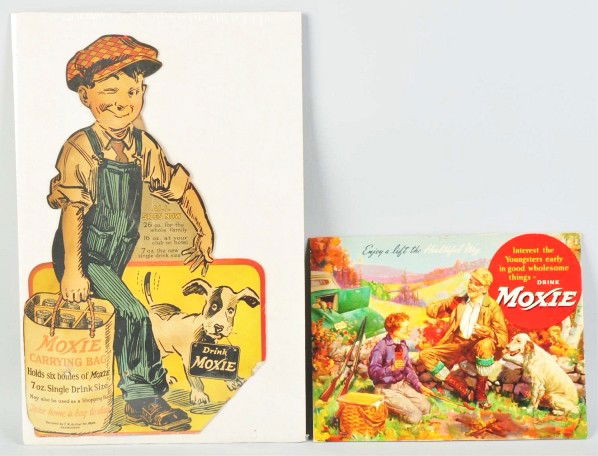 Lot of 2: Cardboard Moxie Signs.: Includes one sign, circa 1920s, depicting a little boy with dog carrying a six-pack bag of Moxie. This sign has a few nail holes, missing lower right corner, one bend at neck, and medium wear. Also in