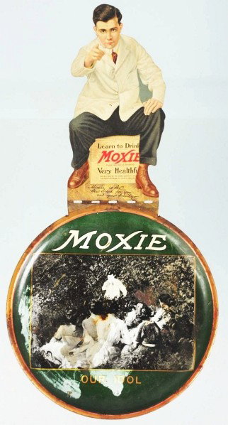 Moxie Tip Tray/Sign Combination.: Circa 1911. Piece is currently folded flat but is designed to have Frank Archer stand straight up when the tray is flat on the table. Good remaining color with some overall surface wear. Condition (Go