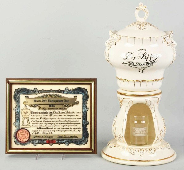 Reproduction Dr. Pepper Dispenser.: 1978. Made by Marv-Art Enterprises. This example is complete with all three pieces, a 1940s display glass, and original presentation plaque. No wear or marks noted. Condition (Near Mint Plus). Size 19