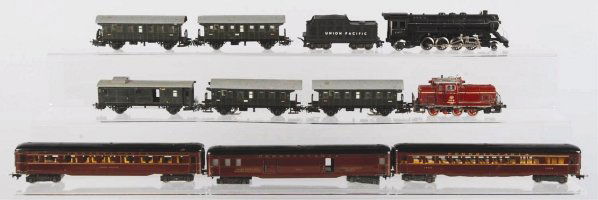 Lot of Marklin & Fleischmann HO Passenger Trains.: German. Post-war. Fleischmann steam engine and tender. Fleischmann electric-style engine with three passenger cars. Also includes five Marklin passenger cars. Condition (Very Good).