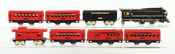 American Flyer O-Gauge Passenger Train Set.: American. Scarce set with steam engine and matching no. 1121 tender. Also includes five passenger cars and one caboose. Some scratching and wear to engine nose cone, near boiler front, and some scratc