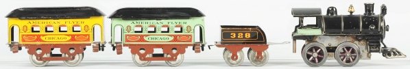 Emond-Metzel American Flyer Clockwork Train Set.: American. O-gauge. Includes clockwork engine with no. 328 tender and two Chicago passenger cars (one yellow and one light green). Very scarce and desirable passenger set with only minor scratching and