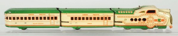 Tin Marx Electric Streamline Train Set.: American. Two-tone green. Includes Union Pacific engine with two passenger cars, track, and transformer. Includes original box. Condition (Excellent).