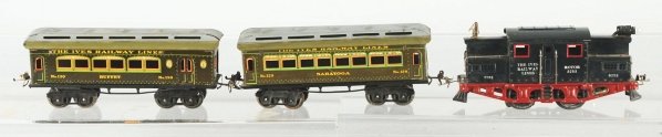 Ives O-Gauge No. 3253 Passenger Train Set.: American. Pre-war. Includes no. 3253 electric style engine and two passenger cars, no. 129 Saratoga and no. 130 buffet car. Minor scratching and wear overall. Condition (Very Good - Excellent).