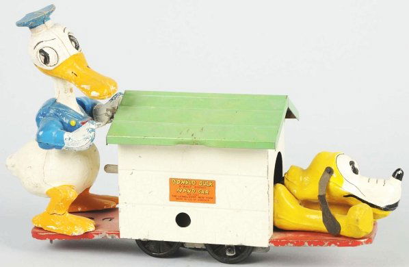 Lionel Disney Clockwork Donald & Pluto Handcar.: American. Pluto has original ears but part of one is missing. Donald Duck has crack on one leg and base of doghouse has some scratching. Condition (Very Good). Size 11" L.