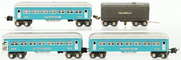 Lionel O-Gauge Partial Train Set.: American. Pre-war. Includes Lionel Lines tender in gun metal gray and three 2600 series passenger cars consisting of two no. 2630 pullman cars and one no. 2631 observation car, all in blue with silver