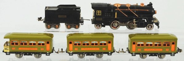 Lionel O-Gauge No. 262 Passenger Train Set.: American. Pre-war. Includes no. 262 steam type engine with matching tender and three passenger cars. Passenger cars consist of two no. 529 cars and no. 530 car. Some wear to copper domes of engine. In