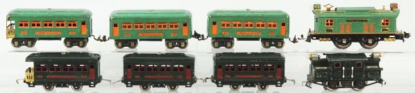 Lot of 2: Lionel O-Gauge Passenger Train Sets.: American. Includes no. 253 electric style engine with three cars, two no. 607 pullman cars, and no. 608 observation car. The other set includes no. 153 electric engine in dark green with three passeng