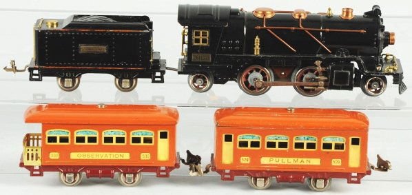 Lionel O-Gauge No. 261 Passenger Train Set.: American. Pre-war. Includes no. 261 steam engine, no. 257T original Lionel Lines orange-striped tender, and two terracotta passenger cars consisting of no. 529 pullman and no. 530 observation. Some sc
