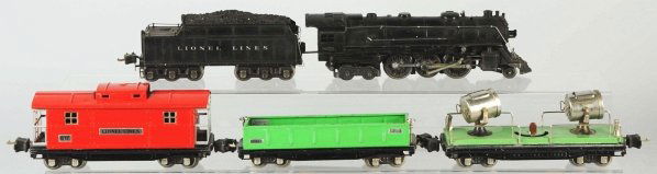 Lionel O-Gauge No. 226E Freight Train Set.: American. Pre-war. Includes no. 226E locomotive with matching no. 2426 Lionel Lines whistle tender, no. 812 gondola car, no. 820 searchlight car, and no. 817 caboose. All cars in nickel trim with some