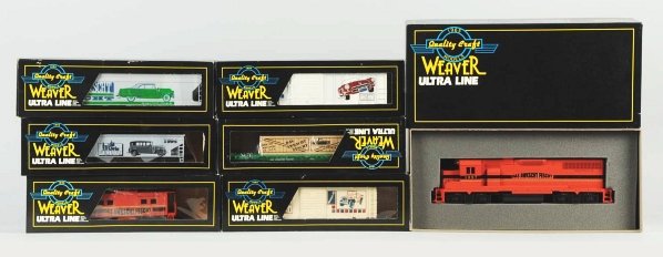 Weaver Das Awkscht Fescht Freight Train Set.: Contemporary, circa 1990s. Includes GP38-22 Diesel Locomotive plus six freight cars, all in original boxes. All have different logos from the festival. Unused condition. Condition (Near Mint).