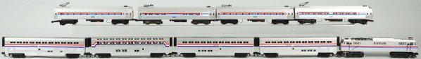 Lot of 2: MTH Amtrak Passenger Train Sets.: American. One set includes no. 960 engine and four passenger cars while the other set has no. 880 power car and three passenger cars. Includes individual boxes for one set. Both sets have very little 