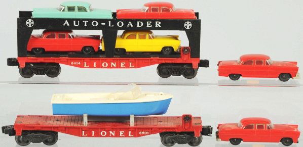 Lot of 2: Lionel Vehicle-Carrying Cars.: American. Post-war. Includes no. 6414 auto loader with six automobiles and no. 6801 boat carrier car. Condition (Very Good - Excellent).