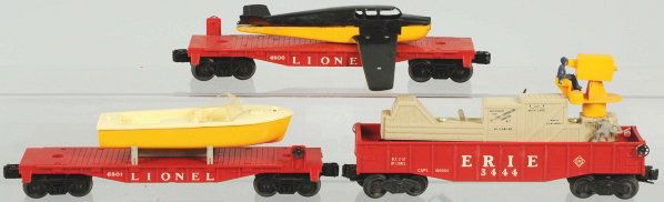 Lot of 3: Lionel Train Cars.: American. Post-war. Includes no. 6800 flat car with airplane (missing front prop), no. 3444 Erie hobo car, and no. 6801 flat car with original box. Includes all original boxes, some with flaps missing