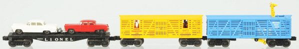 Lot of 3: Lionel Freight Cars.: American. Post-war. Includes no. 6424 automobile flatcar with two autos, no. 6473 Rodeo car, and no. 3376 operating giraffe car. Includes all original boxes with some wear overall. Condition (Very Goo