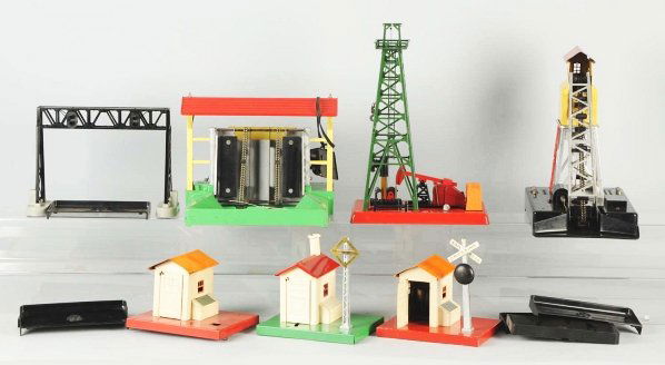 Lot of Lionel Train Accessories.: American. Mostly post-war. Includes lumber loader, coal loader, oil derrick, and other items. Various conditions. Condition (Very Good).