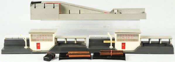 Lot of 3: Lionel Lumber Accessories.: American. Post-war. Includes no. 264 lumber mills and no. 364 lumber loader. Includes all original boxes. Lumber loader box has some staining and fading. Condition (Very Good - Excellent).