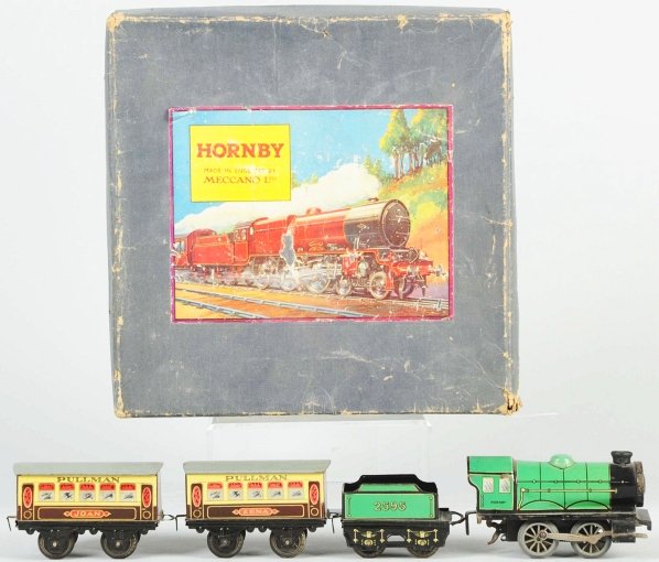 Hornby Passenger Train Set.: English. Includes clockwork engine, no. 2595 tender, and two passenger cars, one marked "Joan" and the other "Zena". Includes original box and original insert with nice paper label on front. Box has s
