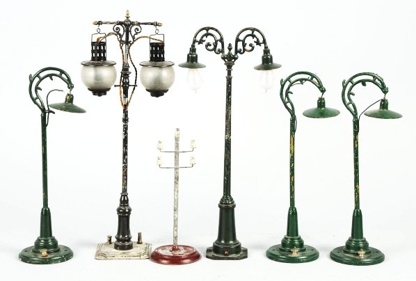 Lot of 6: Vintage Train Lamps.: Various makers include Bing, Lionel, and Ives. Some paint flaking and wear throughout. A few glass globes are missing. Condition (Good - Very Good). Size Largest: 14 - 1/2" T. CORRECTION: This lot con