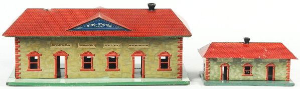 Lot of 2: Tin Litho Bing Train Stations.: German. Pre-war. Includes one larger station and one smaller station, fairly identical. Larger station is missing one stack and both bases have some scratching and wear. Condition (Very Good).