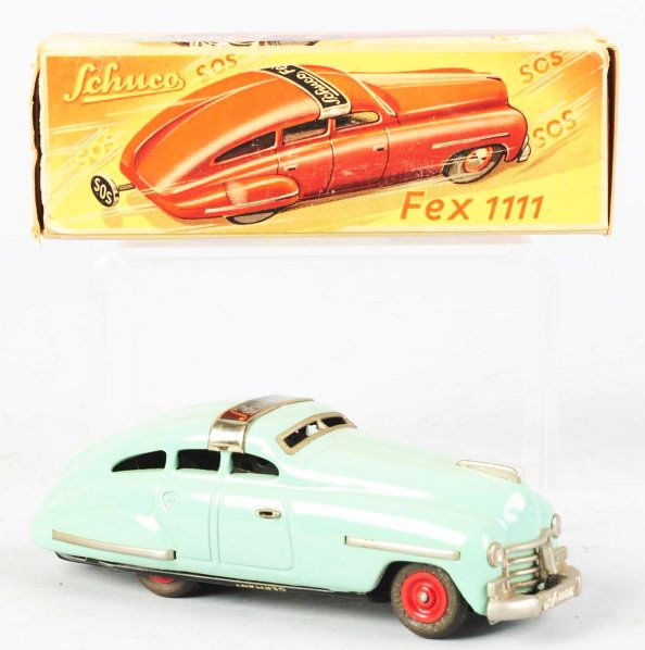 Tin Litho Schuco Fex1111 Auto Wind-Up Toy.: German. Working. Marked "Made in US Zone Germany" on bottom. Plate on roof of car reads "Schuco Fex". Very little wear overall. Includes very colorful original box and instruction sheet. Condition (Ex