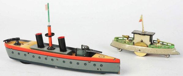 Lot of 2: Tin Litho Hess Boats.: Includes one early flywheel friction gun boat and one tin wind-up gun boat, both with original American Flags. Some minor scratching and wear overall. Condition (Excellent). Size Largest: 9" L.