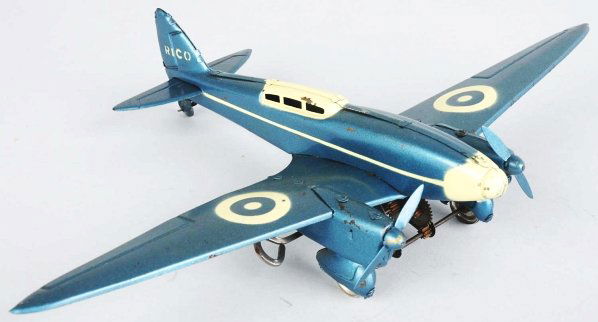 Tin Litho Rico Airplane Wind-Up Toy.: Spanish. Pre-war. Working. De Haviland Comet Racer. This is a Spanish copy of a famous English racing plane. Marked "Rico" on back tail. Some minor scratching and wear to wings. Pictured in "Collectin