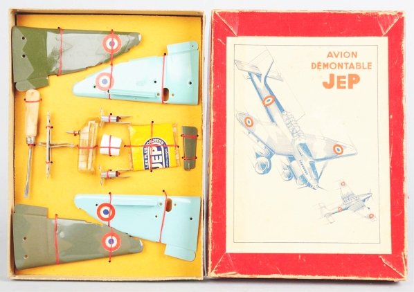 Tin Jep ME109 Civilian Airplane Constructor Set.: French. Post-war. Made by Dux. This is an extremely scarce airplane in unused condition. Comes with original instruction booklet. Includes scarce original box with two trays of pieces of airplanes sti