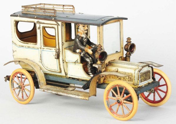 Tin Litho Carette Automobile Wind-Up Toy.: German. Working. Includes original driver, doors, and roof rack. Replaced lamps, driver has one new arm, and rubber tires have been replaced as well. Some scratching and wear overall, especially to fe