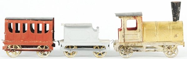 Early Nickel-Toy-Size Passenger Train Set.: French. Circa 1900. Includes early steam type engine with gold wash front, matching tender, and one passenger car. Some scratching and wear to roofs. Condition (Very Good - Excellent).