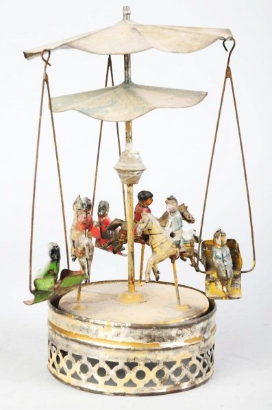 Tin Gunthermann Carousel Wind-Up Toy.: German. Circa 1915. Working. Very fragile, early toy depicts three men riding horses and three girls in swings riding around them. Combination of tin litho and hand-painting. Some paint loss around ba