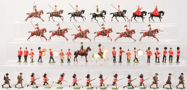 Lot of Approx. 40 English Lead Soldiers.: Includes some on horseback with flags, some band members, and some running guards with rifles. Various conditions, some with damage. Condition (Very Good - Excellent).