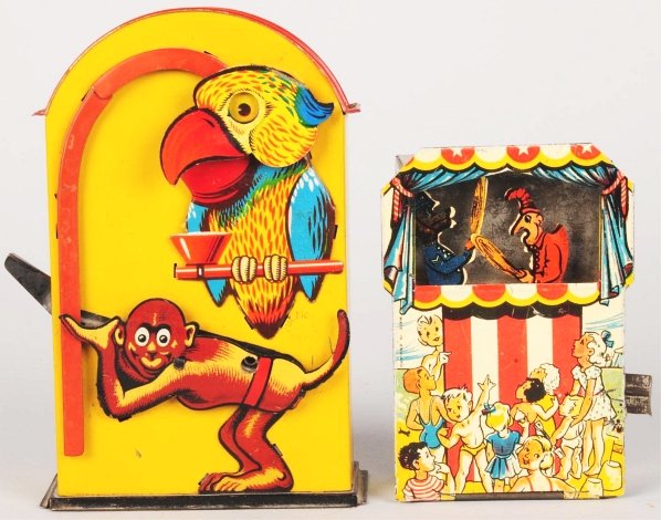 Lot of 2: Tin Litho Semi-Mechanical Banks.: Includes one English Punch and Judy bank with figures of Punch and cop fighting and one German monkey and parrot bank. Both banks have some scratching and wear. Condition (Very Good - Excellent). Size