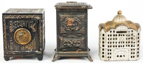 Lot of 3: Cast Iron & Tin Still Banks.: American. Includes one Security Safe Deposit bank, one building bank, and one gas stove bank marked "Save your money and buy a gas stove" with some corrosion to top and front. Various conditions. Cond