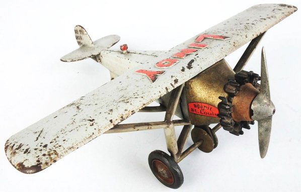 Cast Iron Lindy Spirit of St. Louis Airplane Toy.: American. Made by Hubley. Largest size variation. Embossed "Lindy" in red letters on top of wing and "Spirit of St. Louis" decals on both sides behind engine. Original clacker underneath and propeller