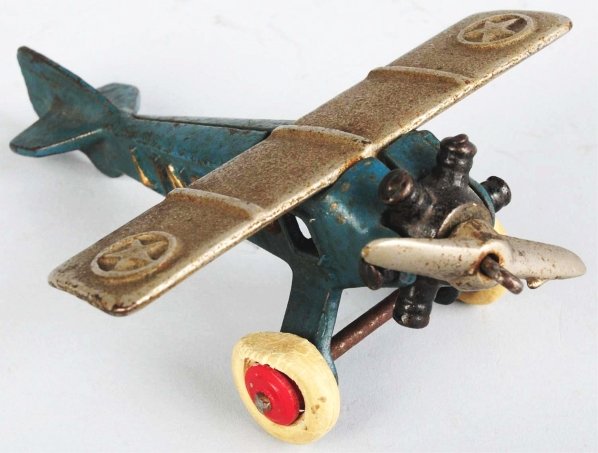 Scarce Cast Iron North & Judd Lindy Airplane Toy.: American. This is the only cast iron plane that was made by North & Judd. Embossed "Lindy" on sides along with the stars in circles on the top wing. Original white rubber tires with red wooden hubs. T