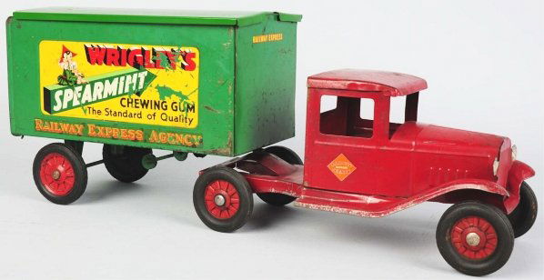 Pressed Steel Buddy L Wrigley's REA Truck.: American. Two-piece cab with one back piece that has lift-off top gate (replacement). Disc wheels with black rubber tires and "Wrigley's Spearmint Gum" and "REA" decals on both sides. Truck has some p